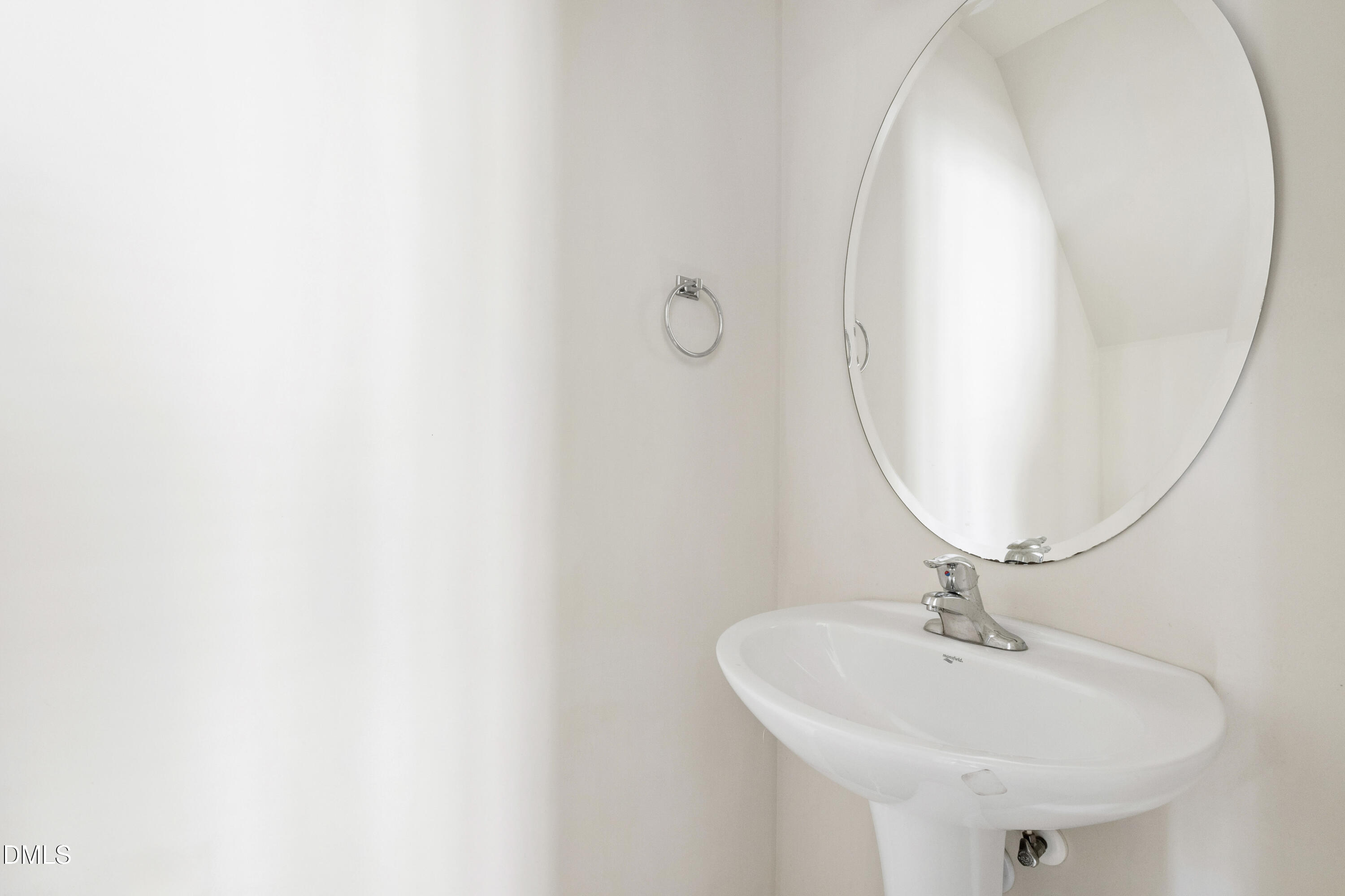 6617 Clarksburg Place Raleigh, NC 27616 - Photo 9 of 30 a bathroom with a sink and a mirror