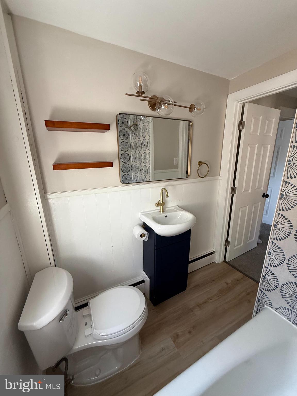 241 Fairview Road Crum Lynne, PA 19022 - Photo 16 of 34 a bathroom with a toilet sink and mirror