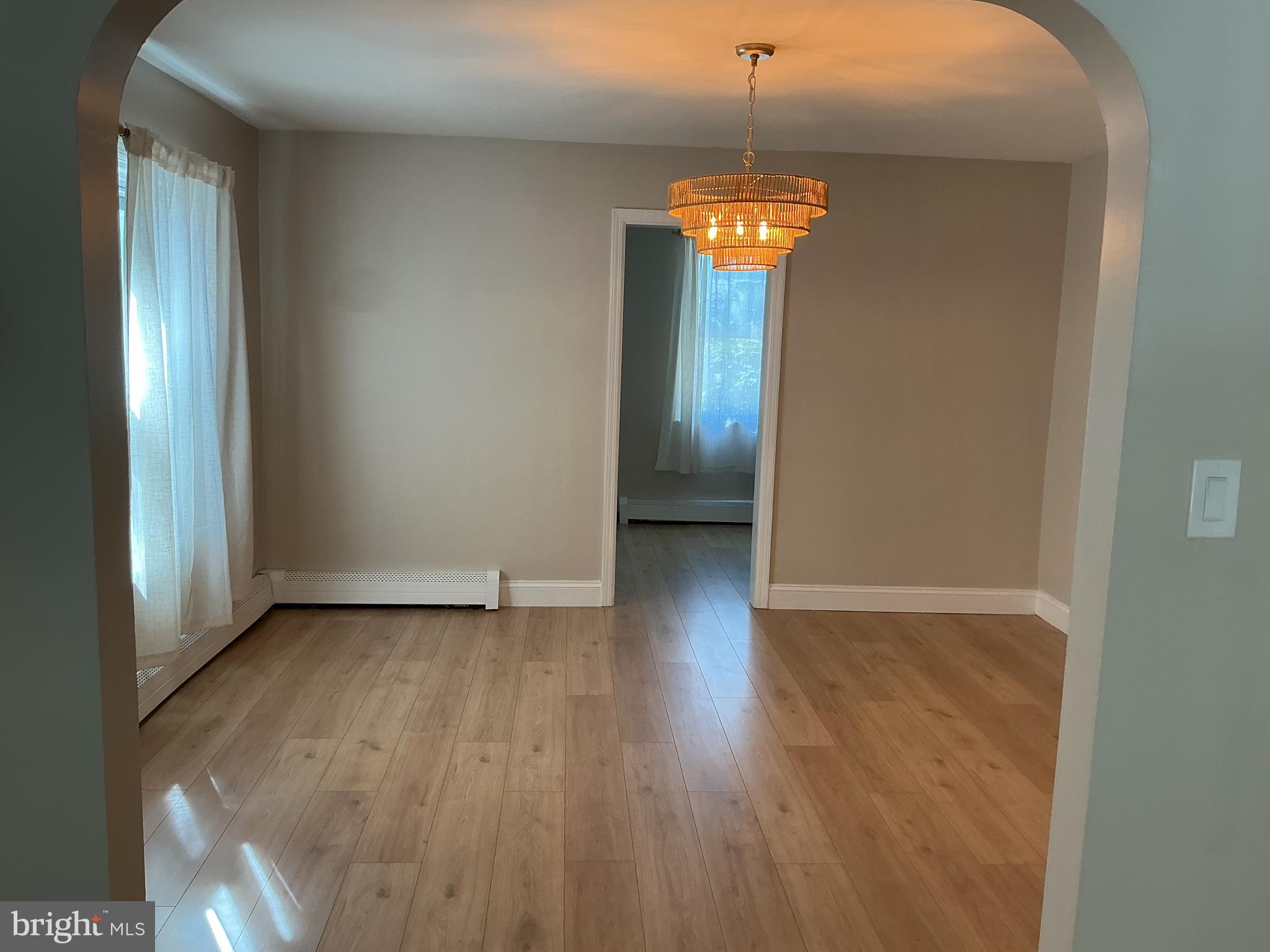 241 Fairview Road Crum Lynne, PA 19022 - Photo 6 of 34 a view of an empty room with a window and a mirror