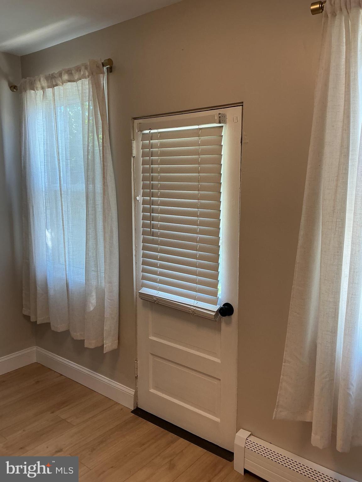 241 Fairview Road Crum Lynne, PA 19022 - Photo 9 of 34 a view of a small space with wooden floor and a window