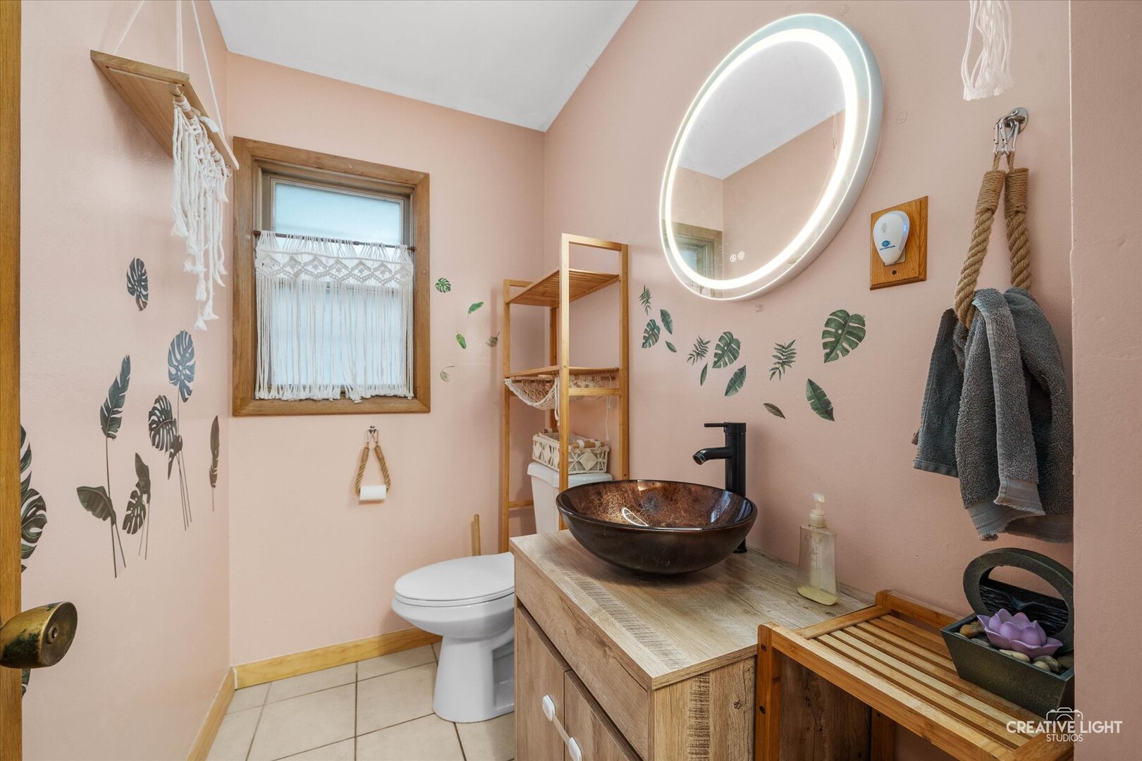 754 Haish Boulevard DeKalb, IL 60115 - Photo 4 of 20 a bathroom with a sink a toilet and a mirror