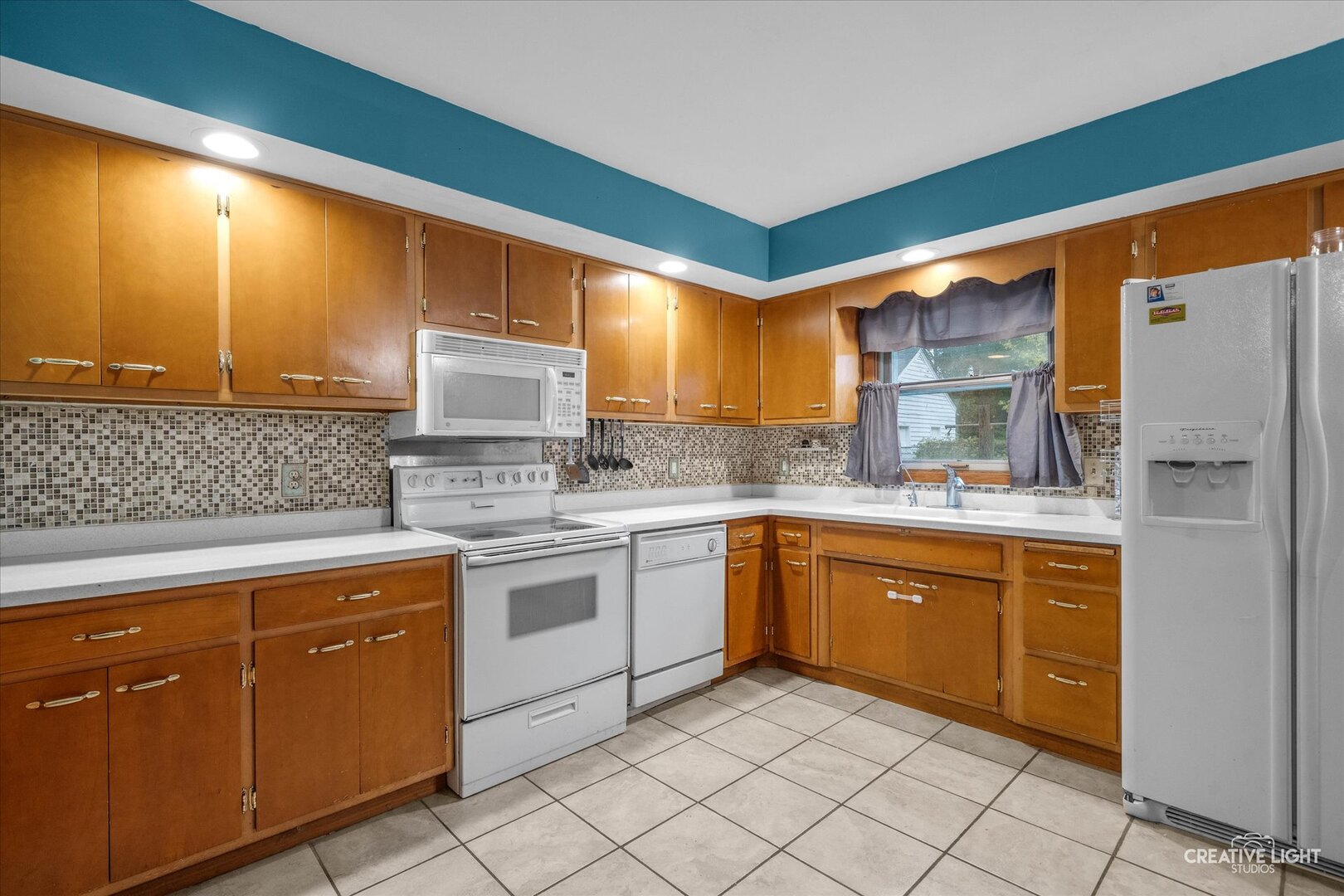 754 Haish Boulevard DeKalb, IL 60115 - Photo 5 of 20 a kitchen with cabinets appliances and a sink