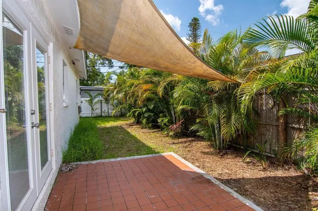 a view of yard from a corridor