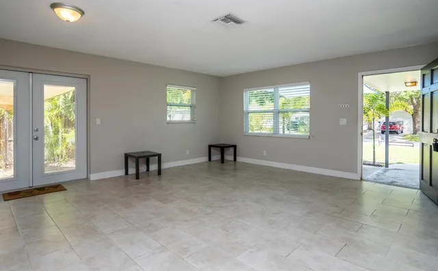 a view of an empty room with a window