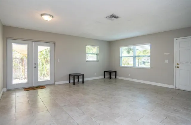 a view of an empty room with a window