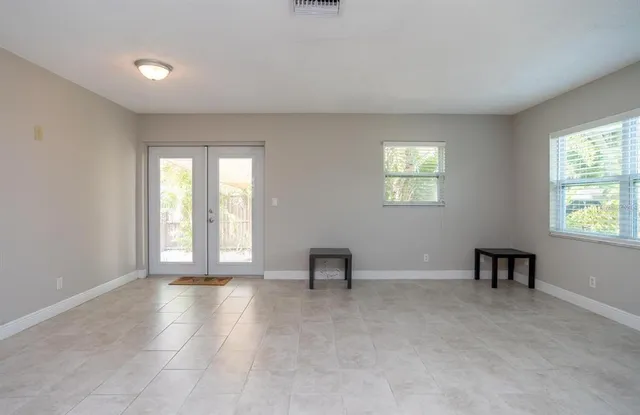 a view of an empty room with a window