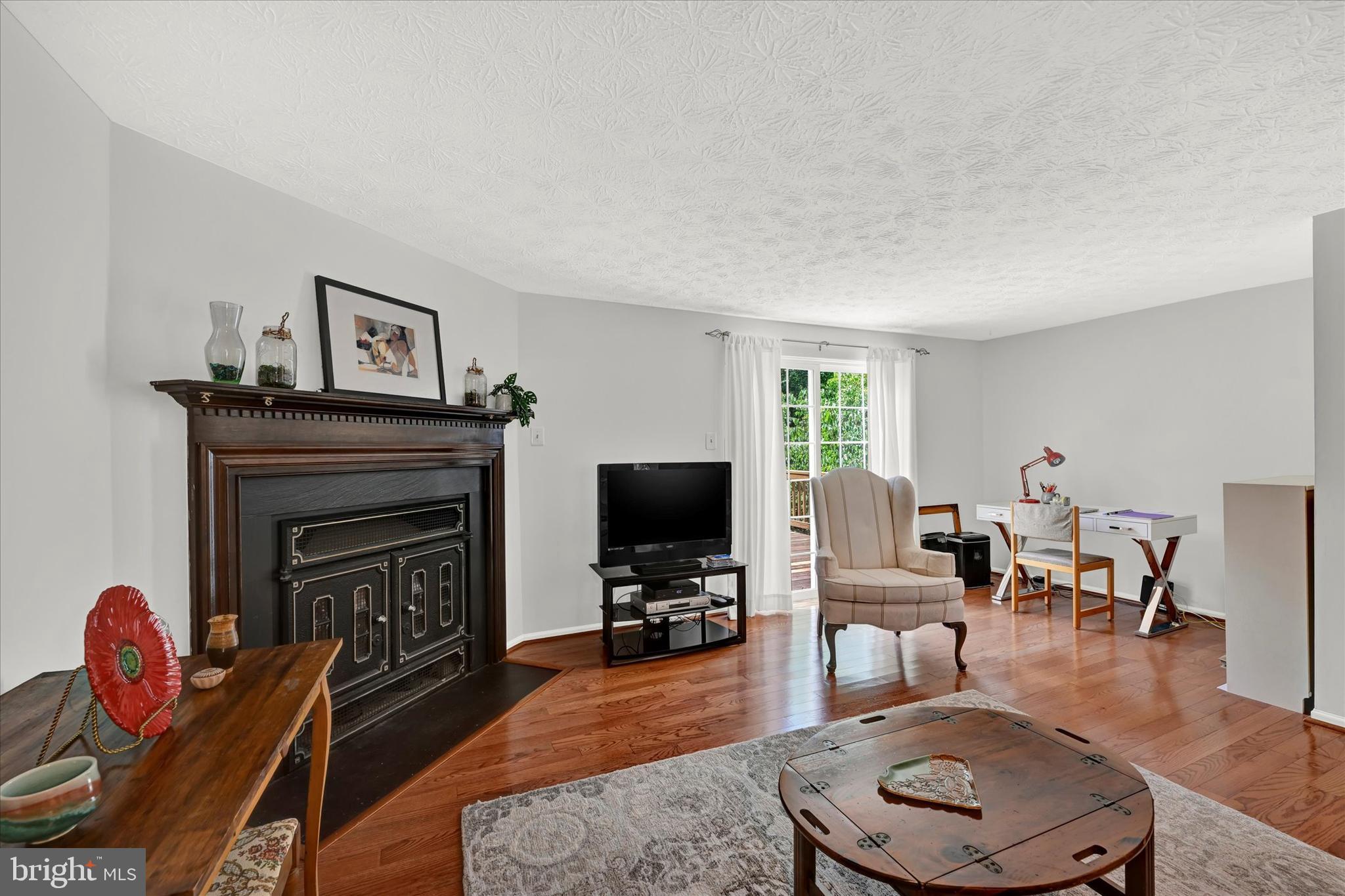 8534 Rhuddlan Road Nottingham, MD 21236 - Photo 10 of 26 Living Room Fireplace with Woodstove Insert