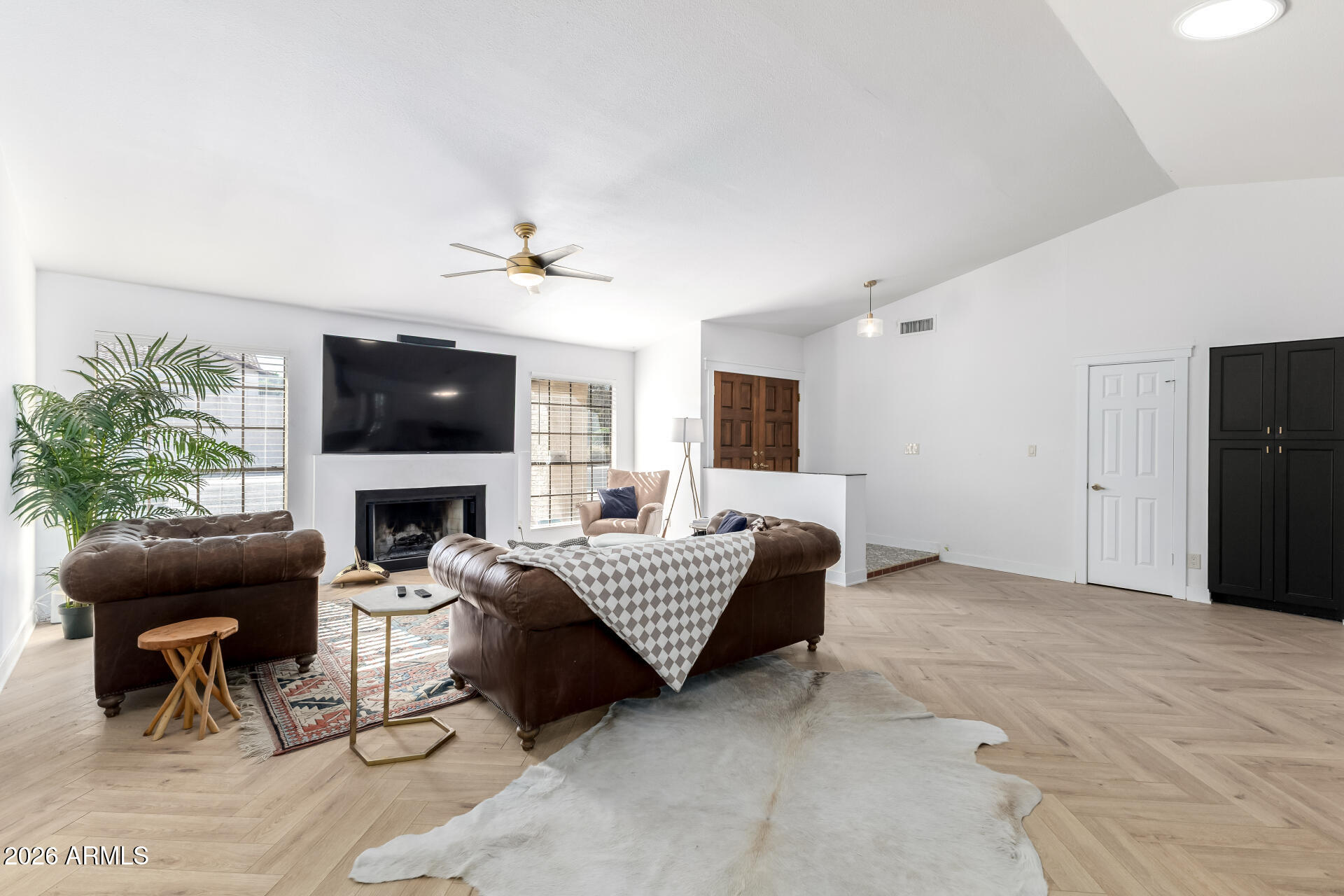 436 East Bluebell Lane Tempe, AZ 85288 - Photo 11 of 59 a living room with furniture a fireplace and a flat screen tv