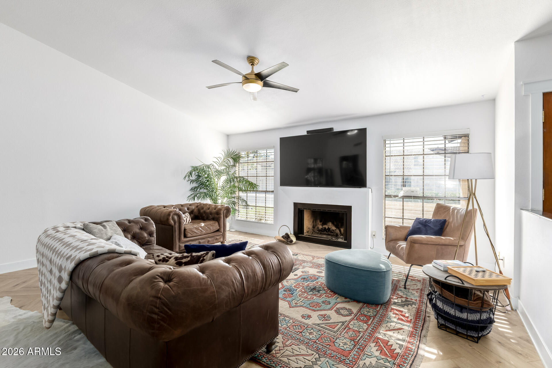 436 East Bluebell Lane Tempe, AZ 85288 - Photo 12 of 59 a living room with furniture and a fireplace