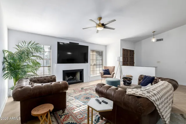 a view of a bedroom with furniture and window
