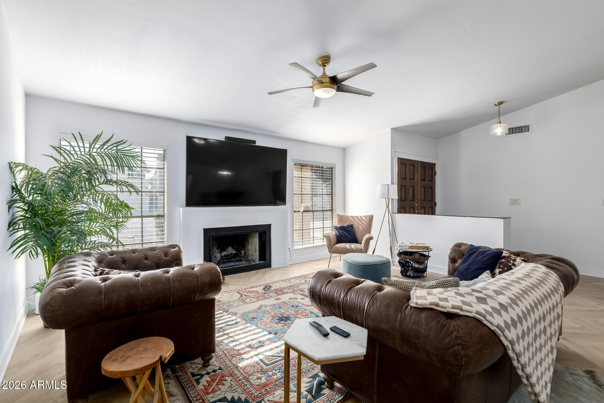 436 East Bluebell Lane Tempe, AZ 85288 - Photo 14 of 59 a bedroom with a bed and a fireplace