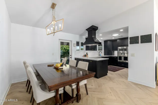 a kitchen with stainless steel appliances a sink stove and refrigerator