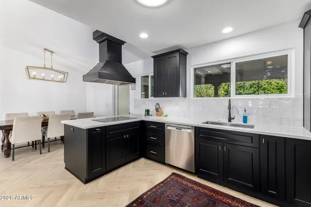 a kitchen with a sink and a stove