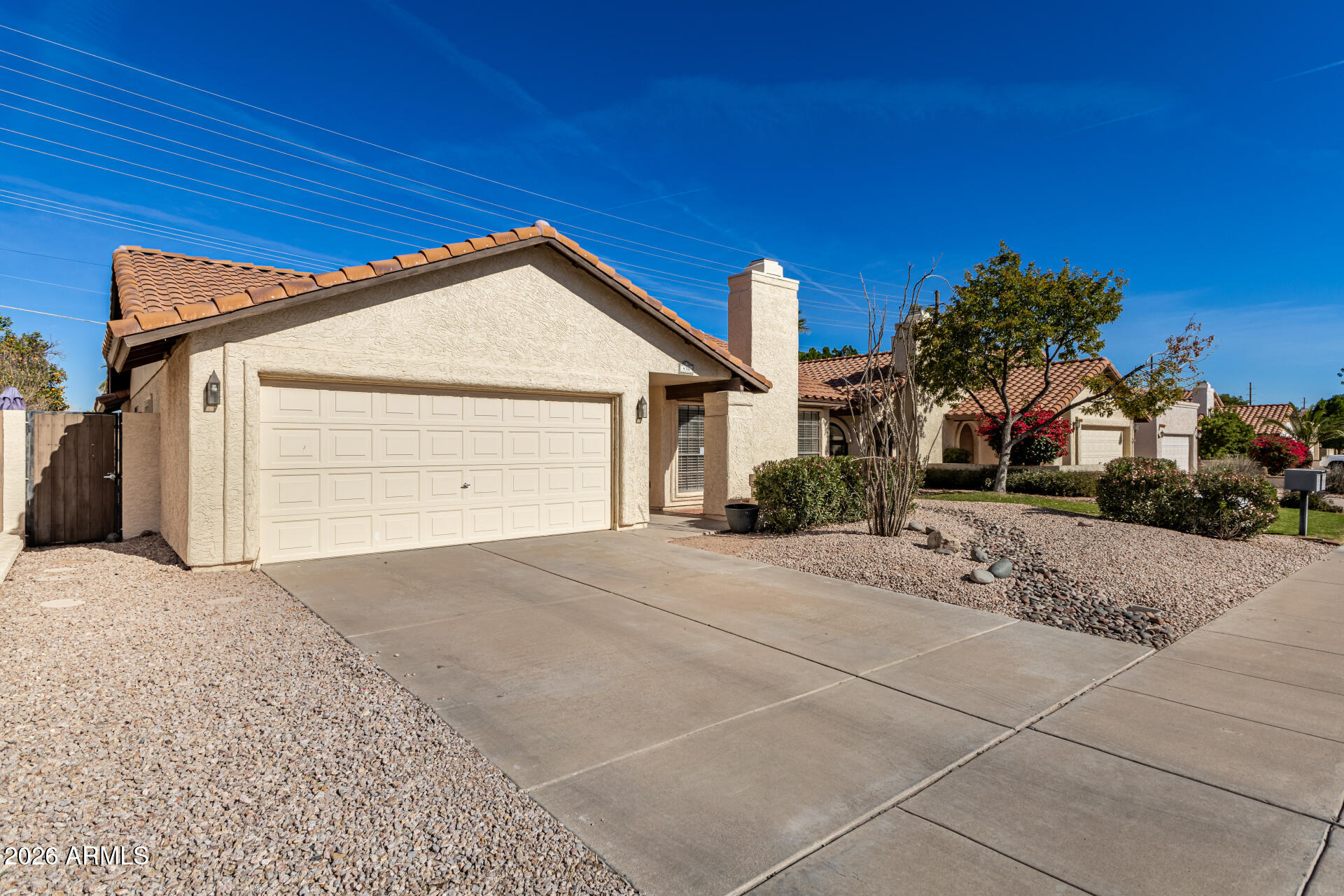 436 East Bluebell Lane Tempe, AZ 85288 - Photo 3 of 59 a front view of a house with a yard and garage