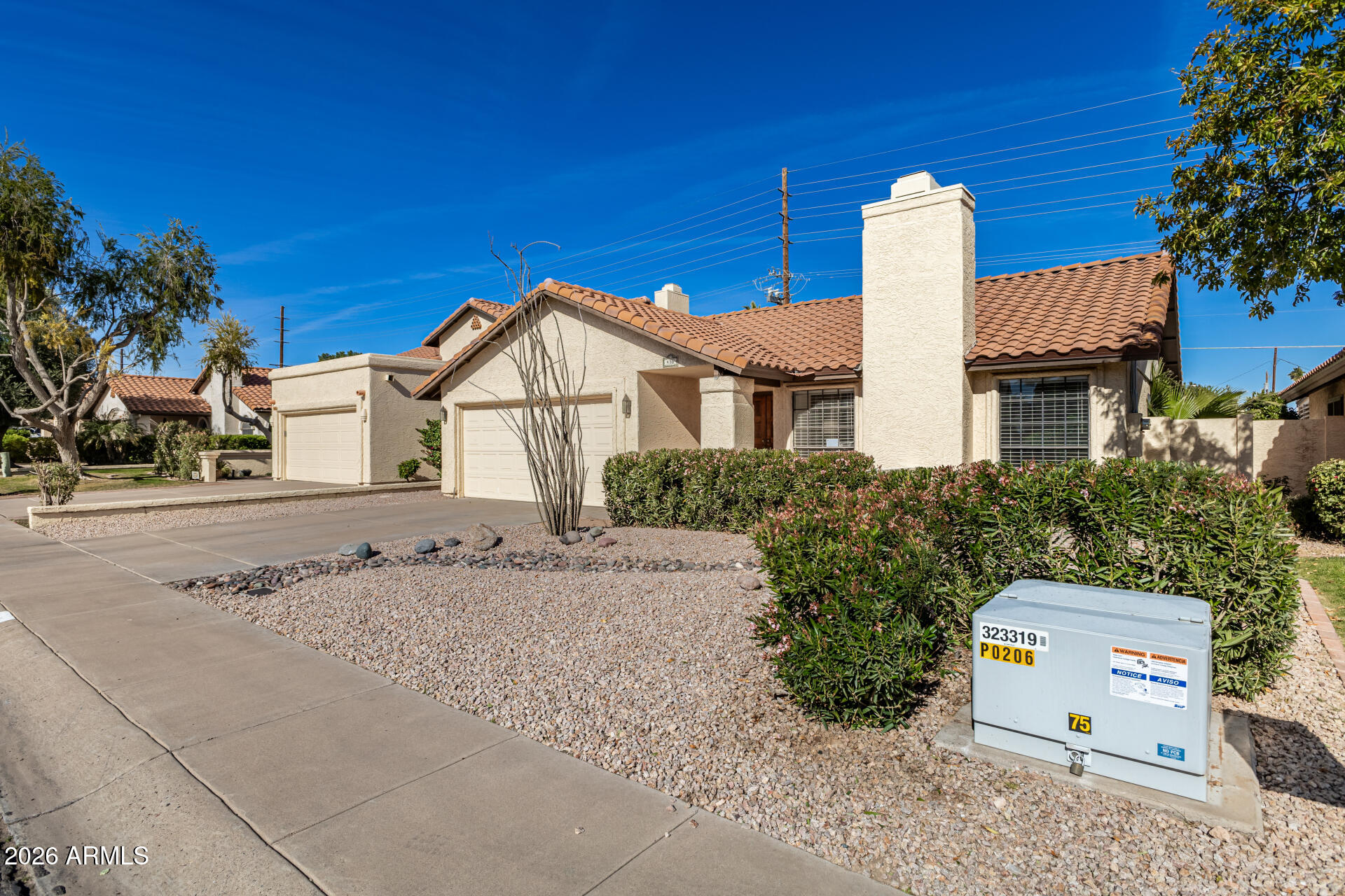 436 East Bluebell Lane Tempe, AZ 85288 - Photo 4 of 59 a front view of a house with a garden