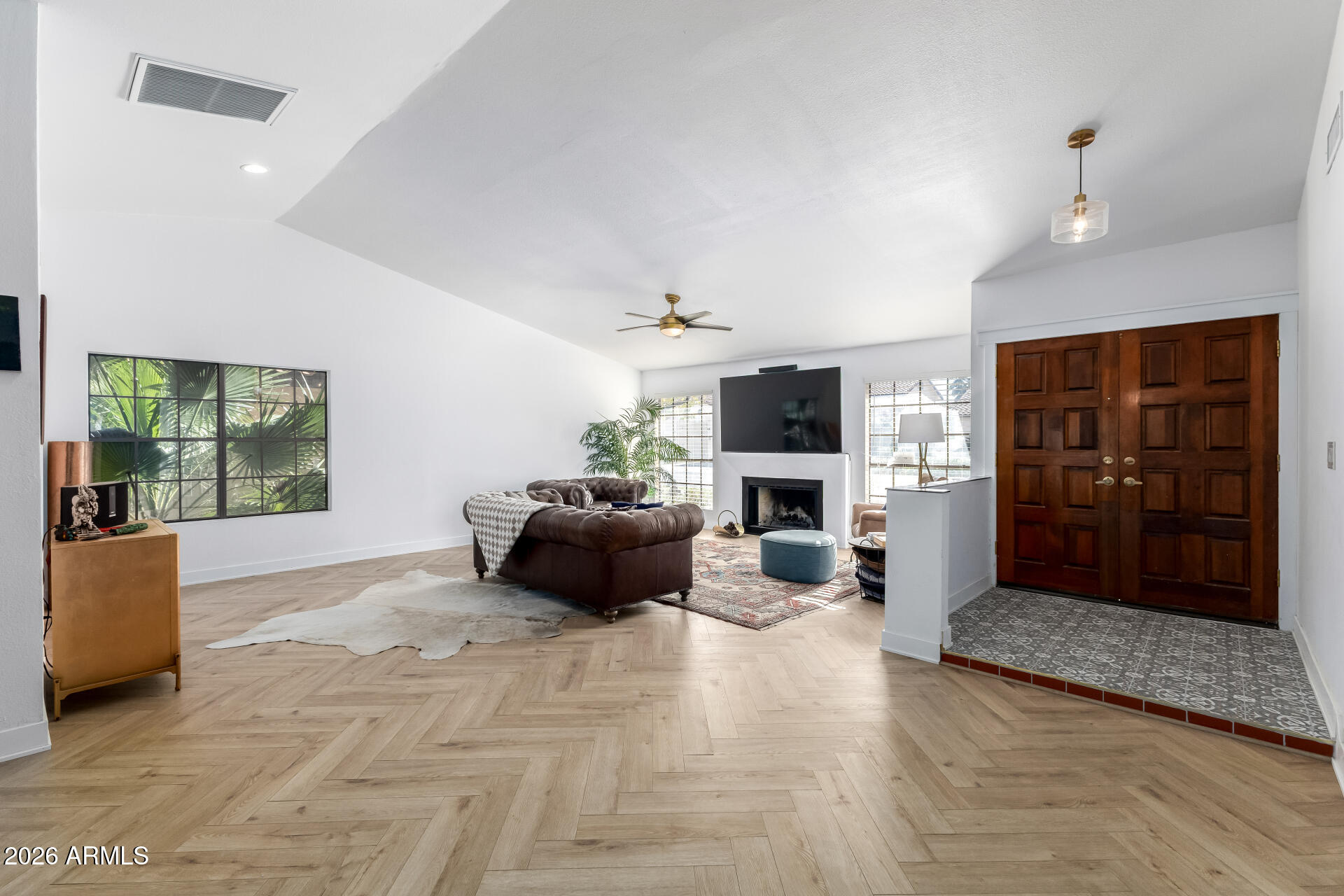 436 East Bluebell Lane Tempe, AZ 85288 - Photo 10 of 59 a living room with furniture and a flat screen tv