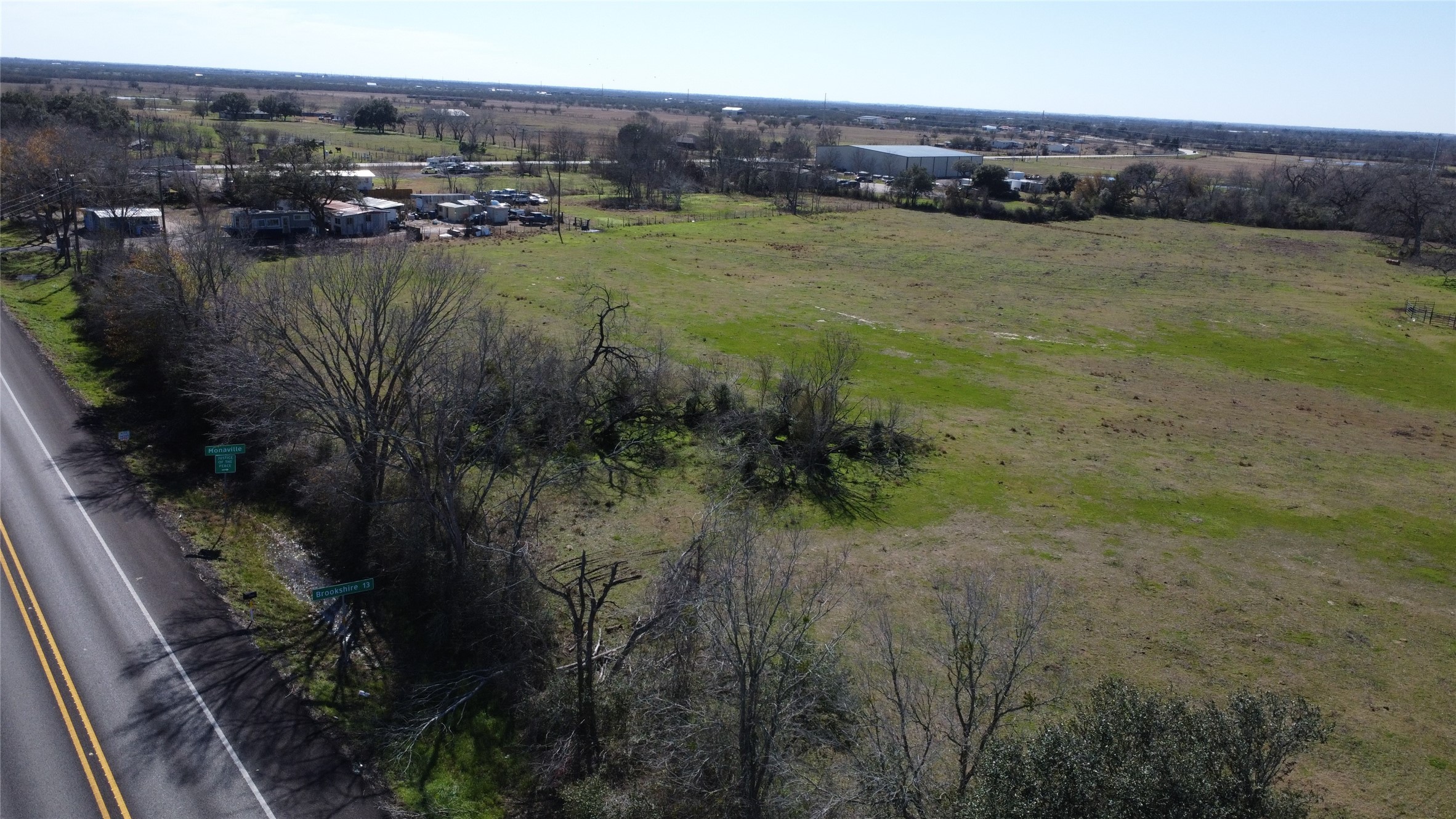 13227 Fm 359 Road Hempstead, TX 77445 - Photo 2 of 9 a view of a lake with houses