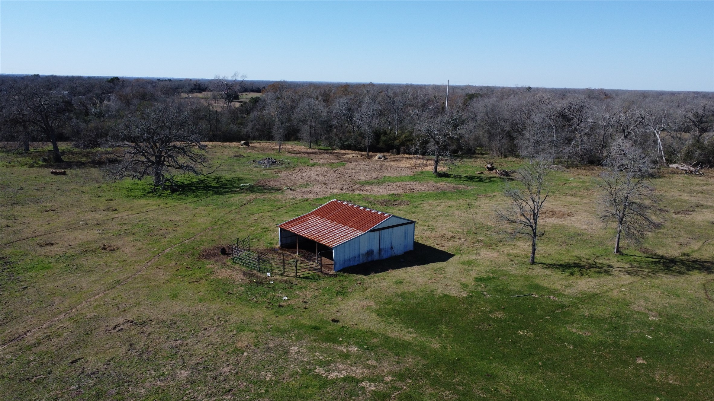 13227 Fm 359 Road Hempstead, TX 77445 - Photo 6 of 9 a backyard of a house with lots of green space