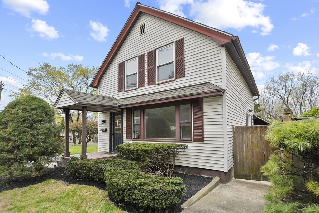 90 Manning Street Hudson, MA 01749 - Photo 1 of 33 a front view of a house with a yard
