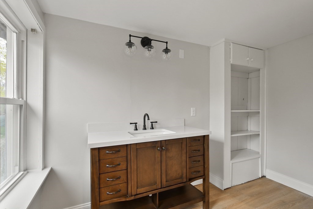 90 Manning Street Hudson, MA 01749 - Photo 13 of 33 a bathroom with a sink a vanity and a mirror