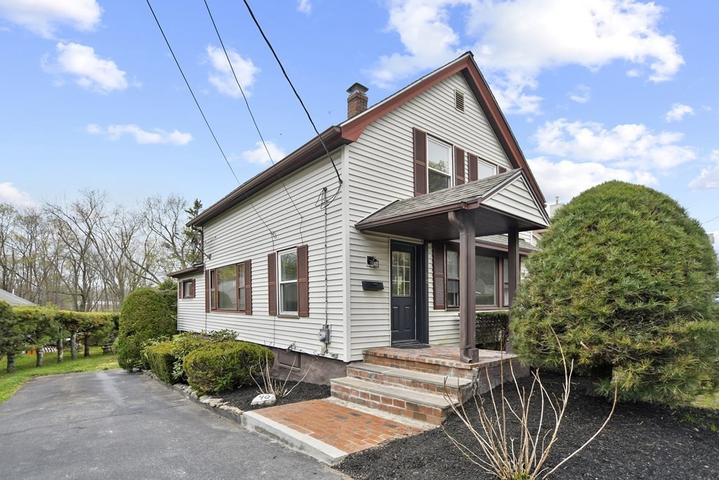 90 Manning Street Hudson, MA 01749 - Photo 26 of 33 a front view of a house with garden
