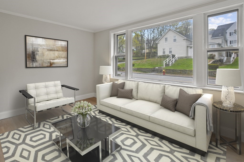 90 Manning Street Hudson, MA 01749 - Photo 3 of 33 a living room with furniture and a large window