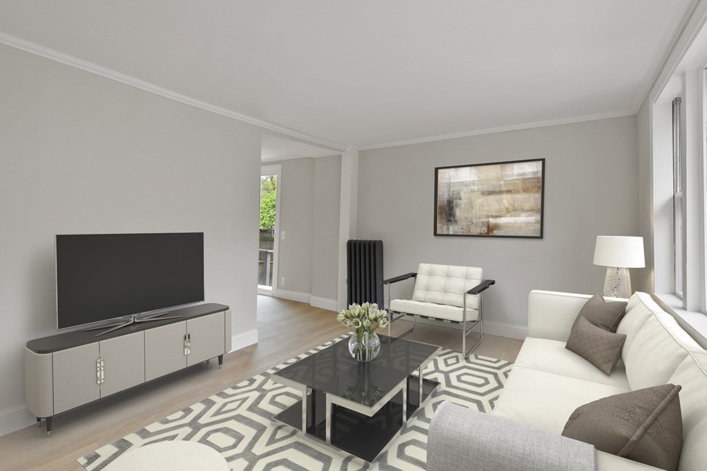 90 Manning Street Hudson, MA 01749 - Photo 4 of 33 a living room with furniture and a flat screen tv