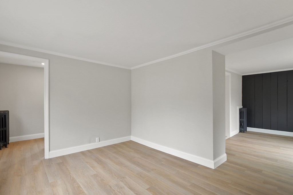 90 Manning Street Hudson, MA 01749 - Photo 5 of 33 a view of an empty room with wooden floor