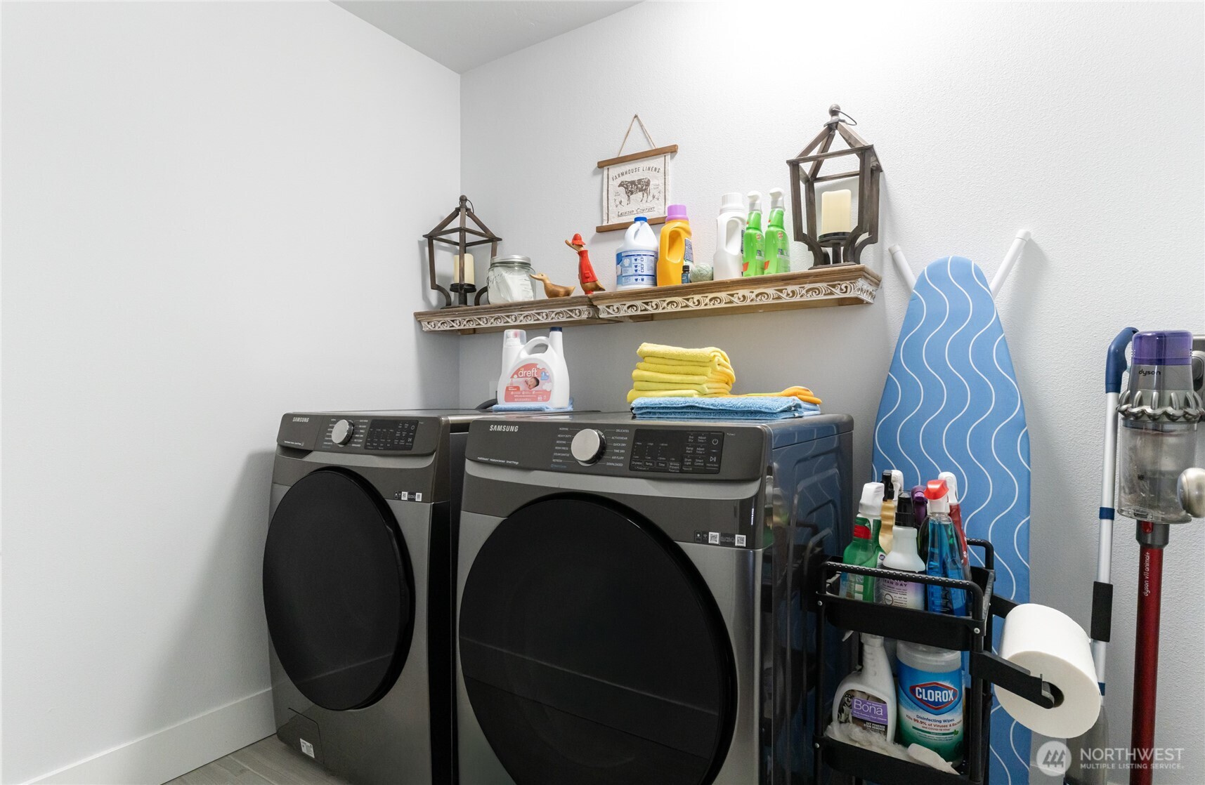 928 Q Street Southwest Quincy, WA 98848 - Photo 20 of 26 a utility room with dryer washer and a view of living room
