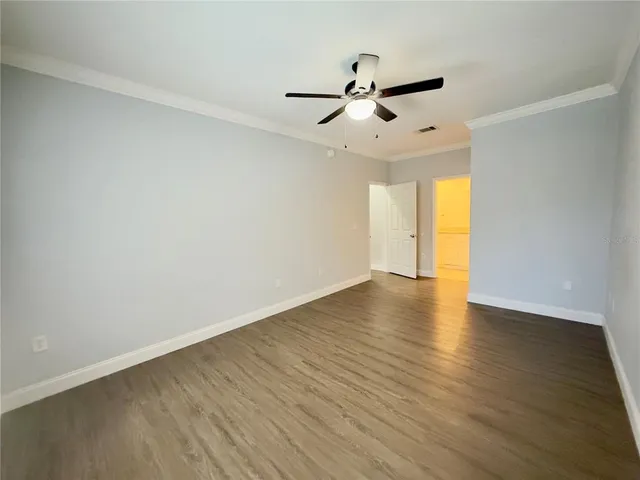 a bathroom with a granite countertop sink a toilet and bathtub
