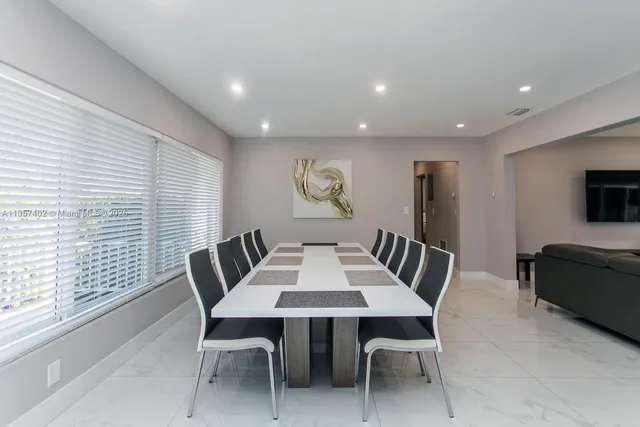 a living room with furniture kitchen and a view of kitchen