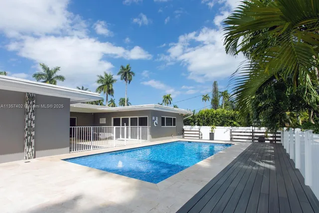 a view of a house with swimming pool
