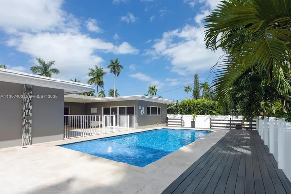 a view of a house with swimming pool