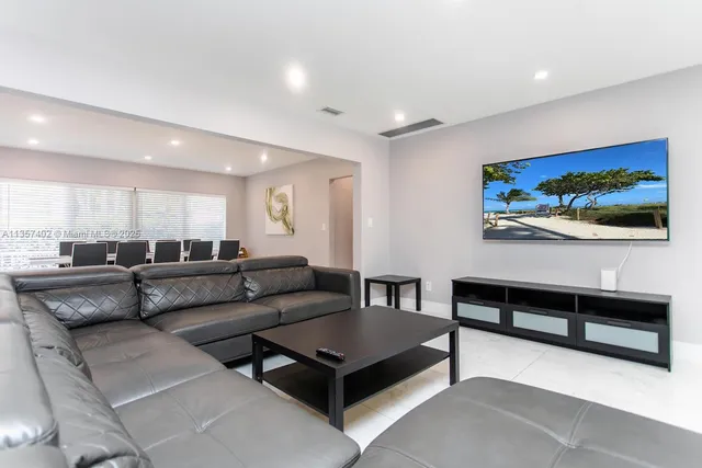 a kitchen with stainless steel appliances a refrigerator and a sink