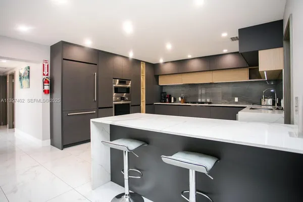 a bedroom with two beds and a flat screen tv