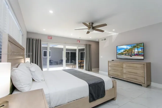 a large spacious bathroom with a large tub and shower