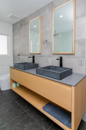 a bedroom with a bed and a tv