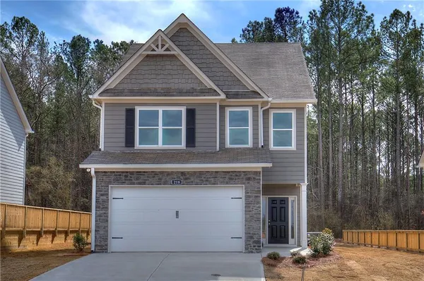 a front view of a house with a garage