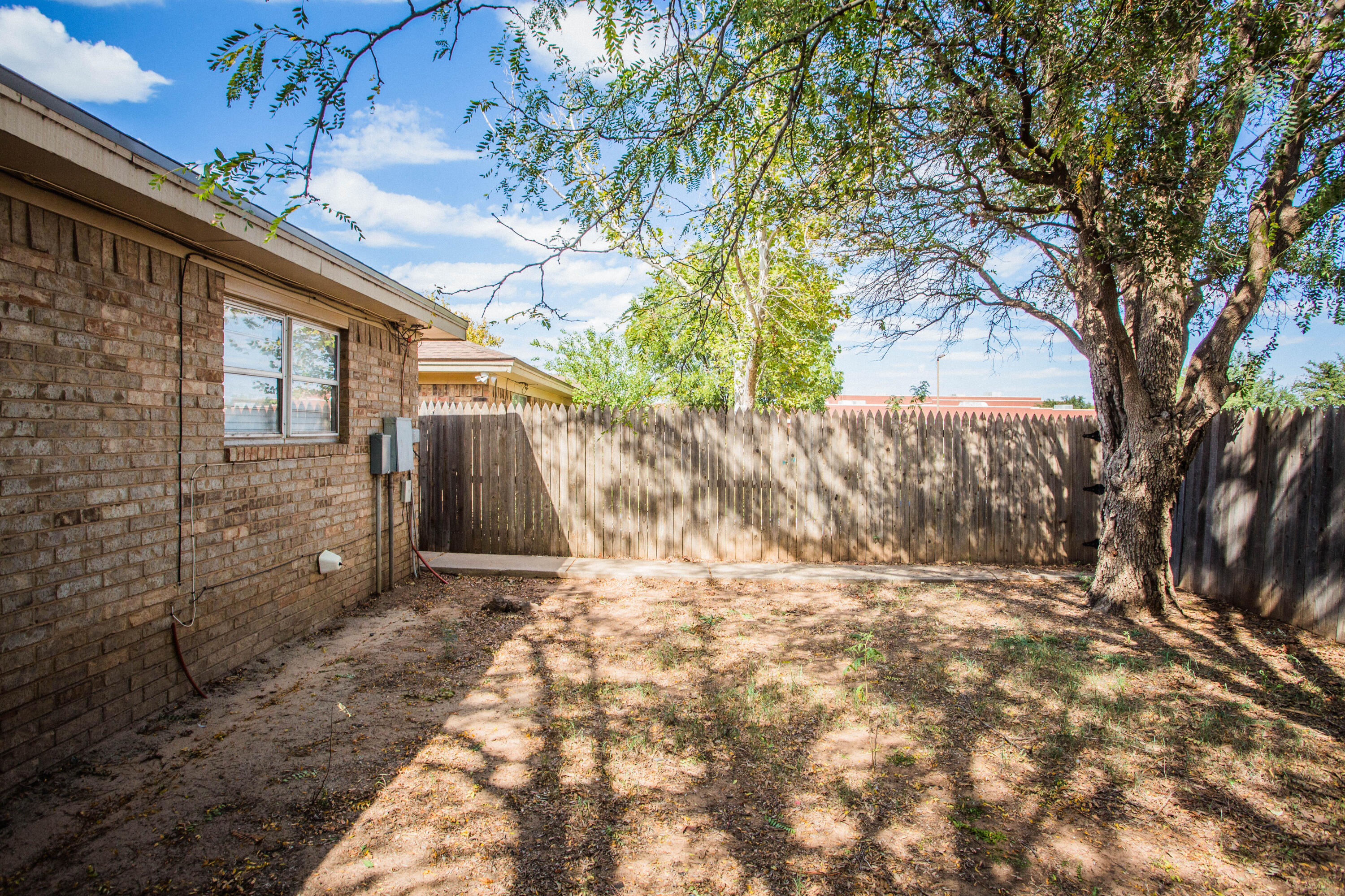7903 Aberdeen Avenue Lubbock, TX 79424 - Photo 33 of 47 a view of a backyard of the house