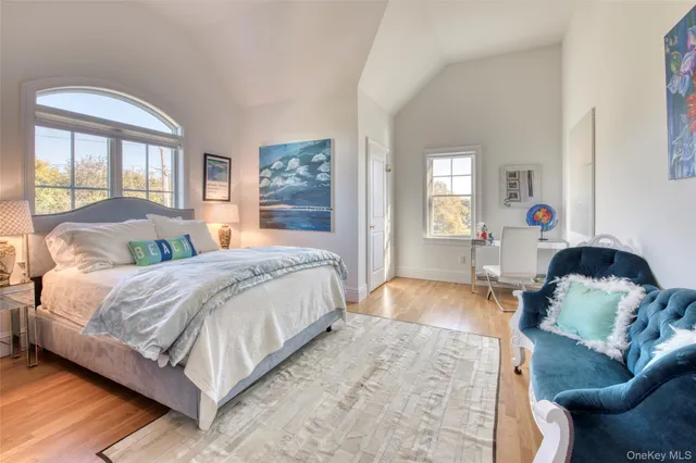 a spacious bedroom with a bed and window