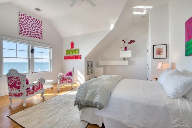 a bedroom with furniture and a wooden floor