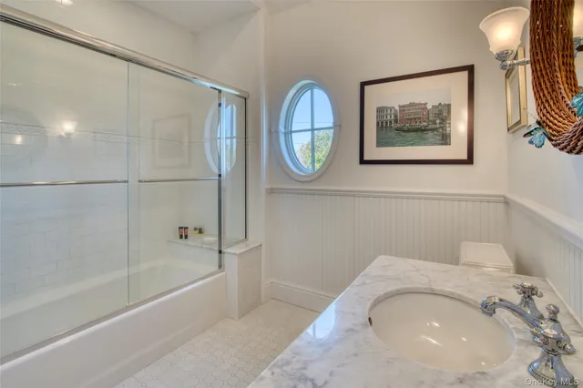 a bathroom with a tub and a shower