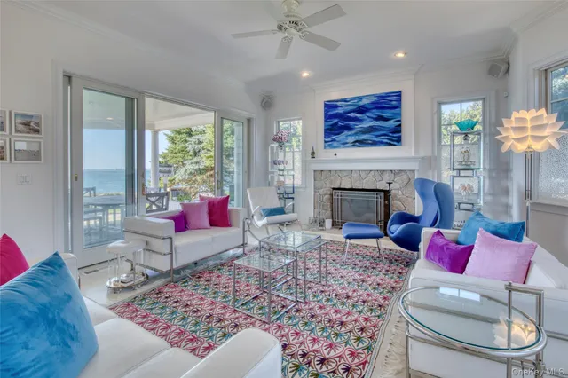 a living room with furniture a rug and a fireplace