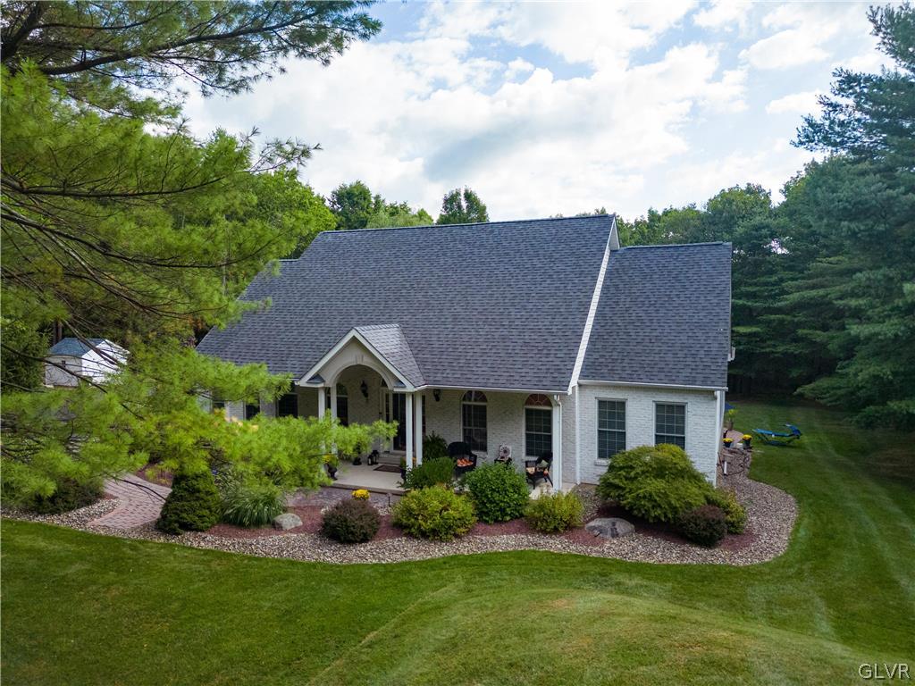 1539 Rachel Road Stroudsburg, PA 18360 - Photo 2 of 50 a front view of a house with a yard and garage