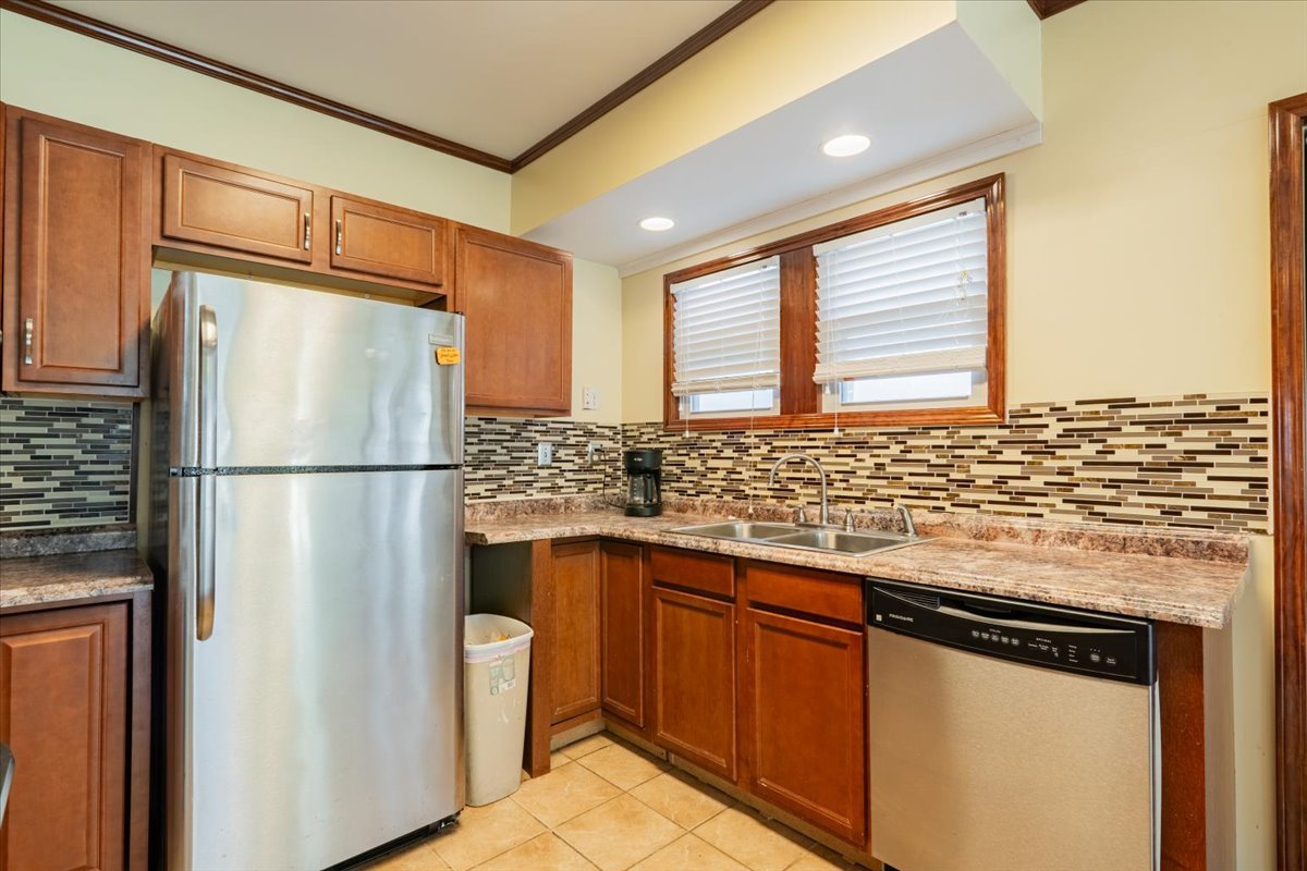603 South Main Street Eureka, IL 61530 - Photo 14 of 32 a kitchen with stainless steel appliances granite countertop a refrigerator and a sink