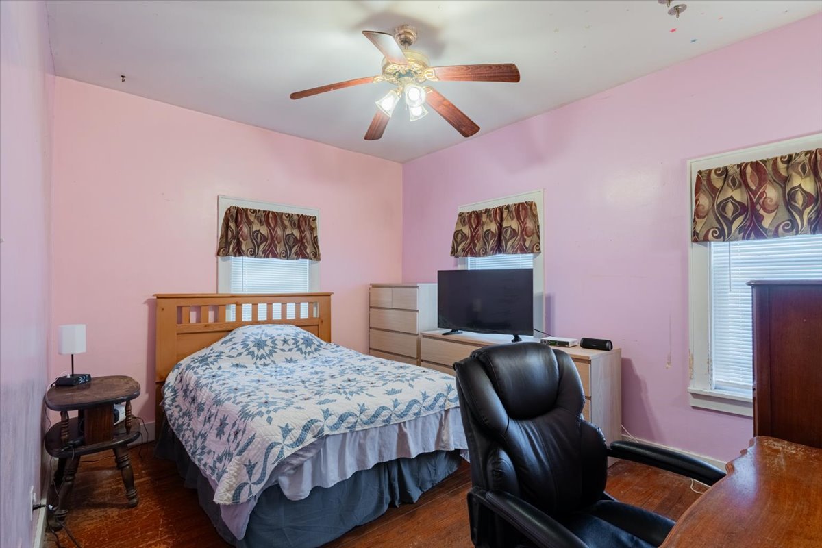 603 South Main Street Eureka, IL 61530 - Photo 17 of 32 a bedroom with a bed and a chair