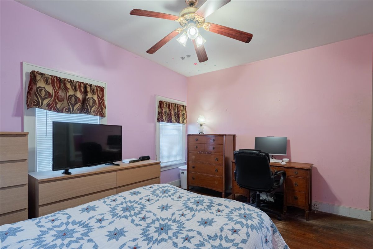 603 South Main Street Eureka, IL 61530 - Photo 18 of 32 a bedroom with a bed and a flat screen tv