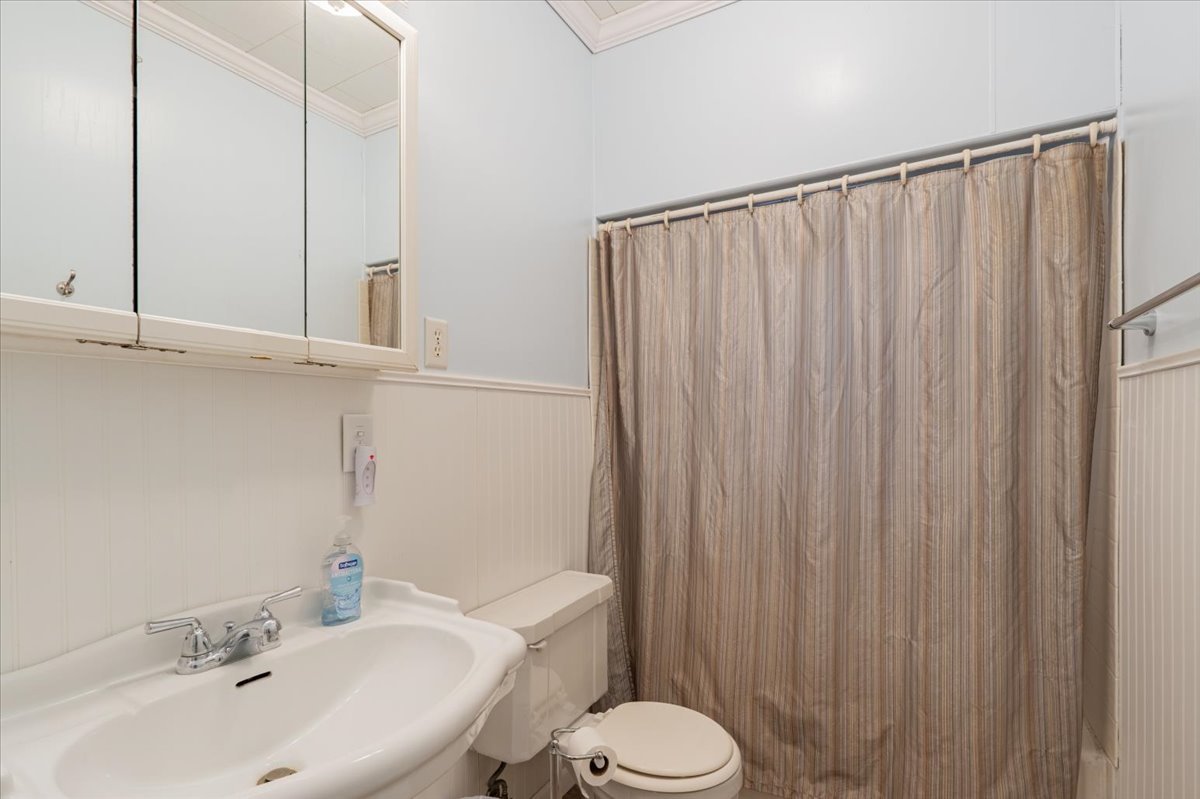 603 South Main Street Eureka, IL 61530 - Photo 24 of 32 a bathroom with a sink and a toilet