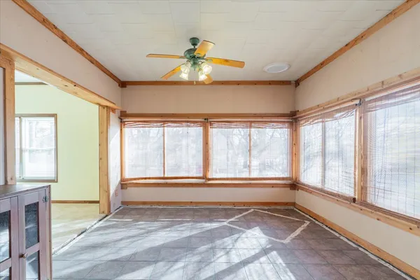 a view of an empty room with a window