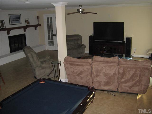 1700 Su John Road Raleigh, NC 27607 - Photo 11 of 18 a living room with furniture and a flat screen tv